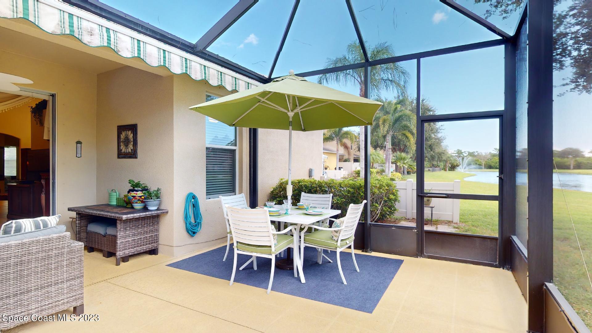3242 Arden Circle Melbourne, FL 32934 - Photo 24 of 28 a view of a dining room with furniture and chandelier