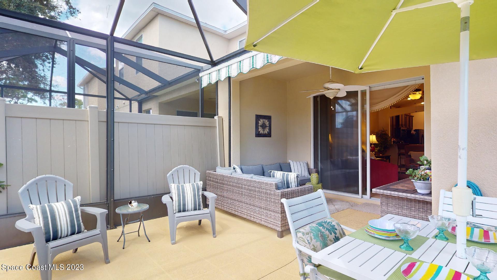 3242 Arden Circle Melbourne, FL 32934 - Photo 26 of 28 a front view of a house with outdoor seating