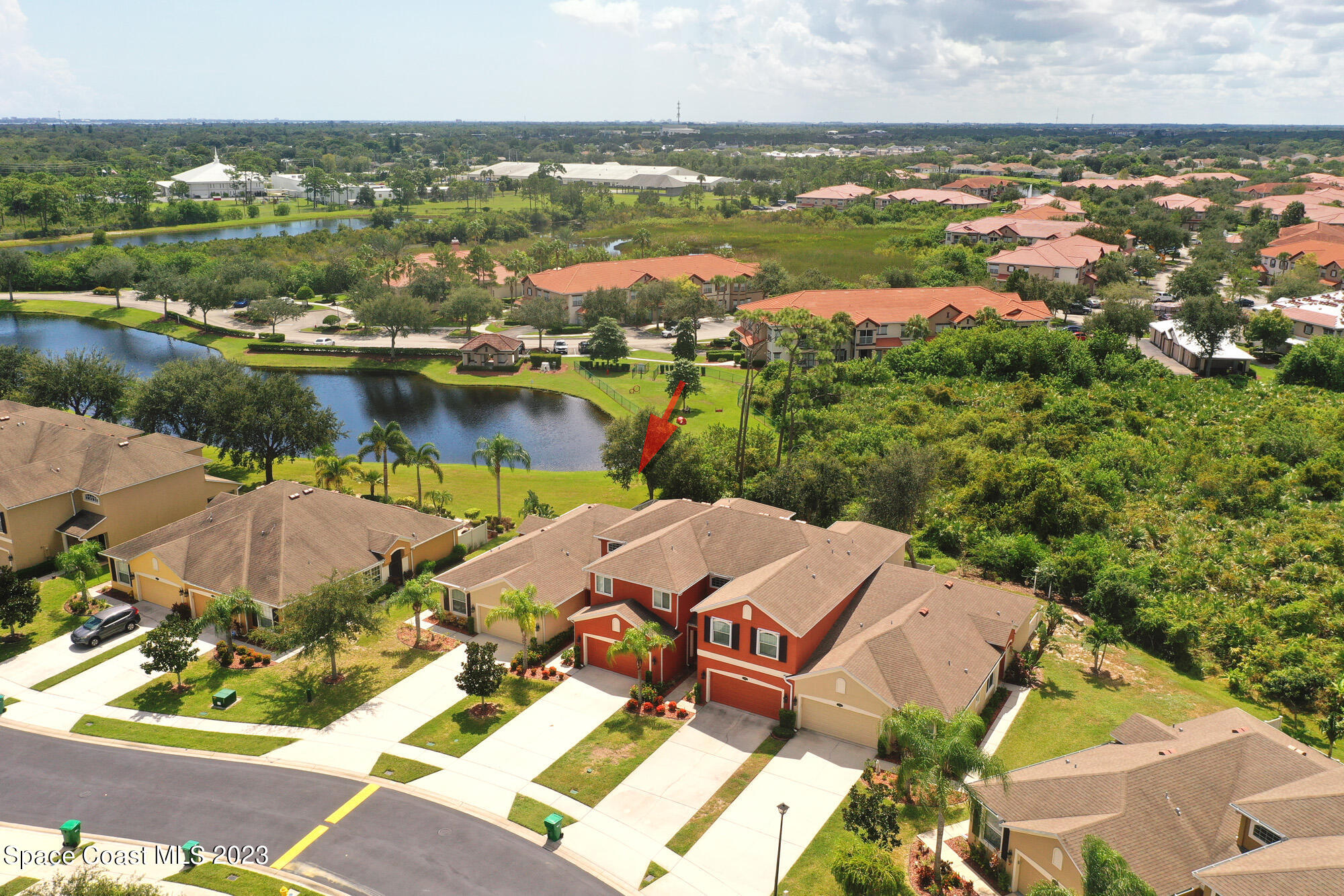 3242 Arden Circle Melbourne, FL 32934 - Photo 4 of 28 an aerial view of a house with a lake view