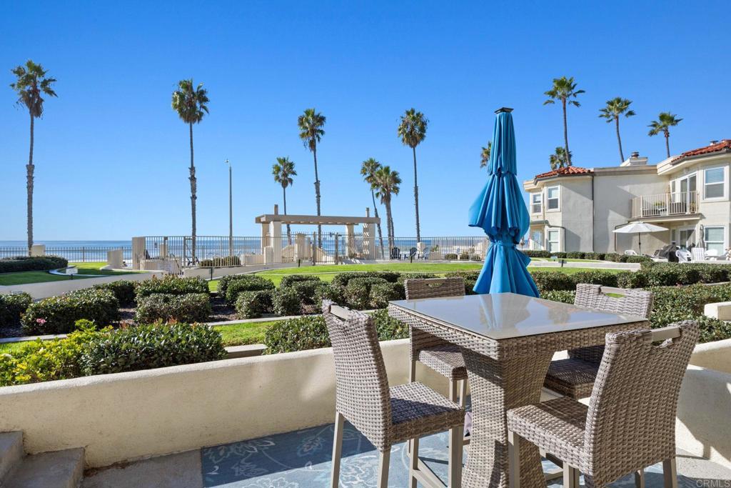 600 The Strand North, Unit 25 Oceanside, CA 92054 - Photo 2 of 25 a view of a patio with table and chairs potted plants