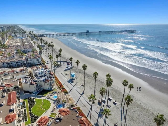 an aerial view of beach and ocean