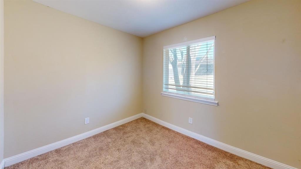 3005 Meandering Way Bedford, TX 76021 - Photo 11 of 22 an empty room with a window