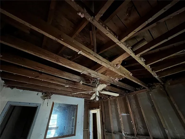 a view of an empty room and wooden floor