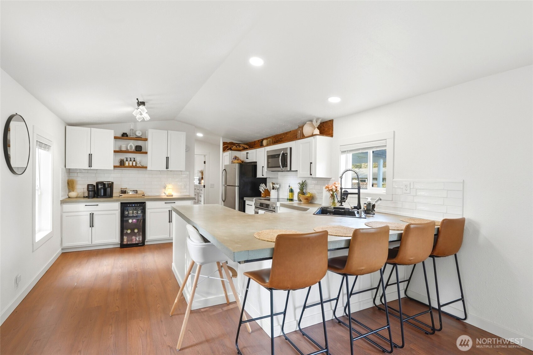 915 Dyer Road Sultan, WA 98294 - Photo 11 of 28 a large kitchen with a table and chairs in it