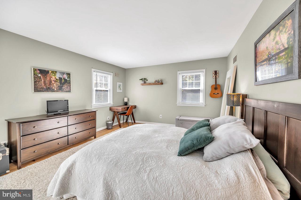 118 Blackwell Road Pennington, NJ 08534 - Photo 23 of 33 a bedroom with a bed and a painting on the wall