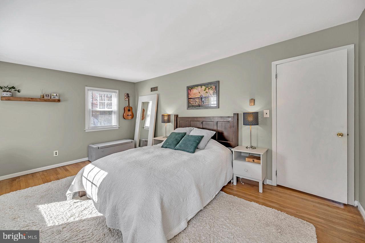 118 Blackwell Road Pennington, NJ 08534 - Photo 24 of 33 a bedroom with a bed and wooden floor