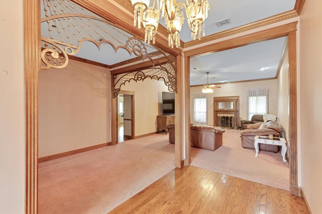 2717 Clear Lake Road Weatherford, TX 76087 - Photo 8 of 40 Hardwood floors in entry with crown moulding