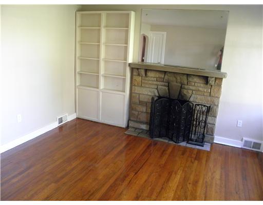 1705 Roosevelt Road Sewickley, PA 15143 - Photo 11 of 14 Living Room. The living room has a fireplace and built-in bookshelves!