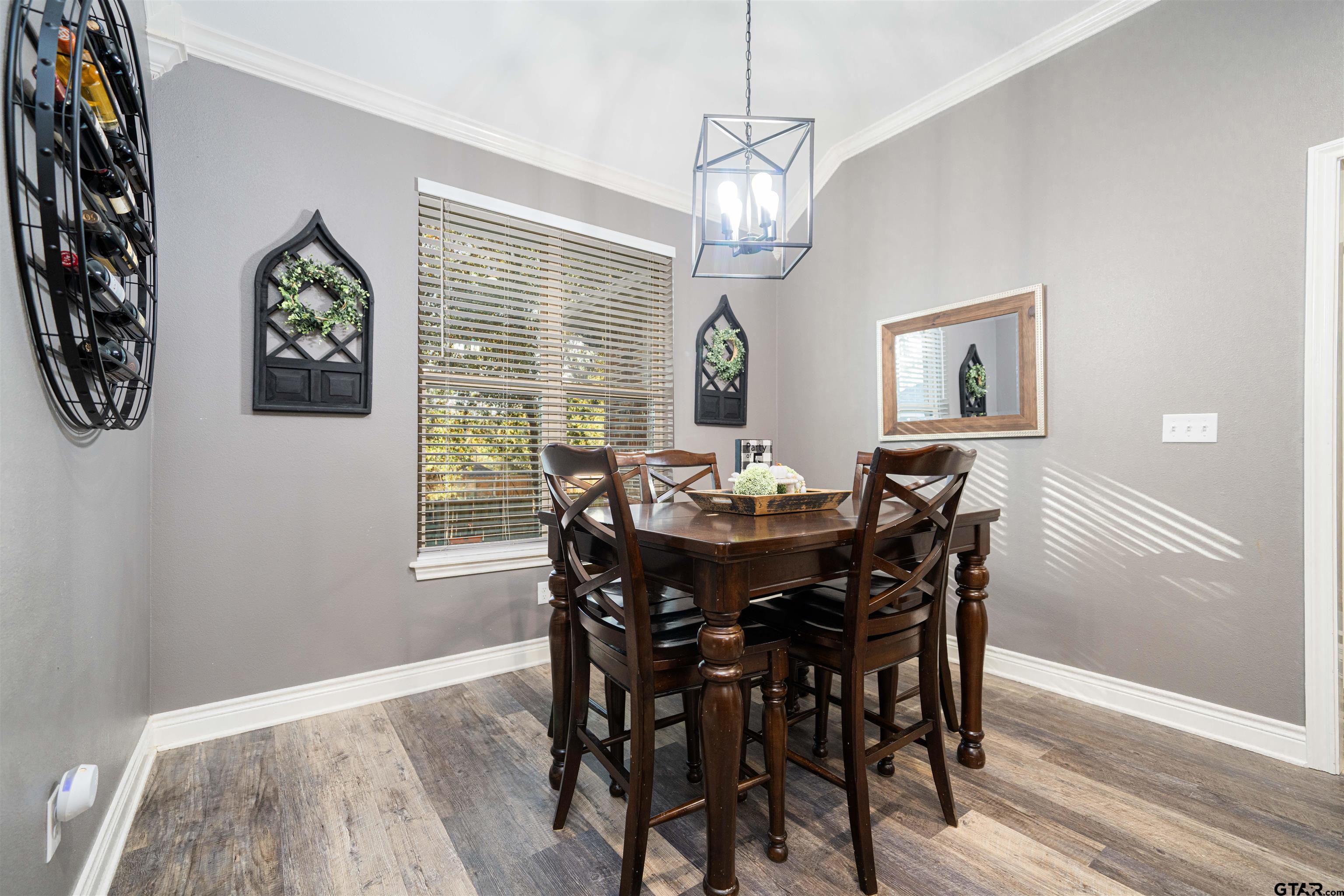 1001 Millstone Lane Chandler, TX 75758 - Photo 12 of 30 a view of a dining room with furniture window and wooden floor