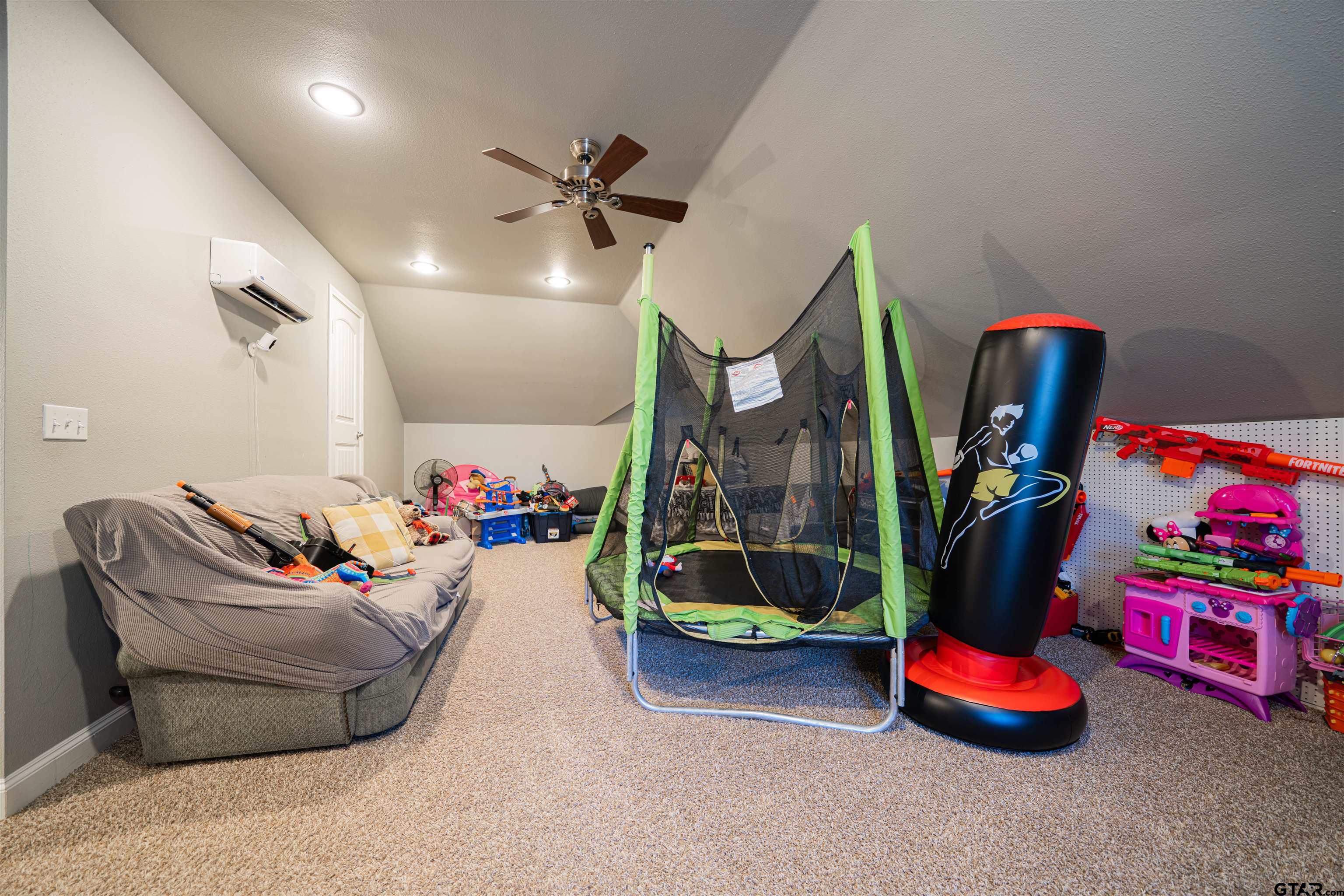 1001 Millstone Lane Chandler, TX 75758 - Photo 22 of 30 a living room with lots of furniture and toys