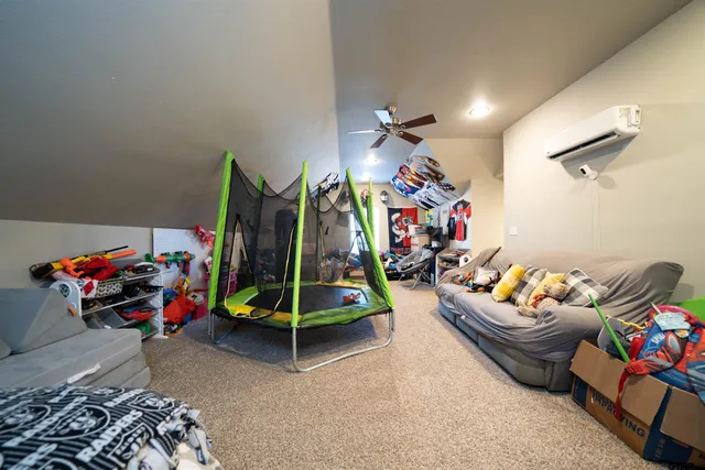 a view of a house with large trees and a big yard