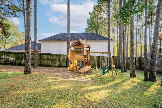 a view of a house with a tree