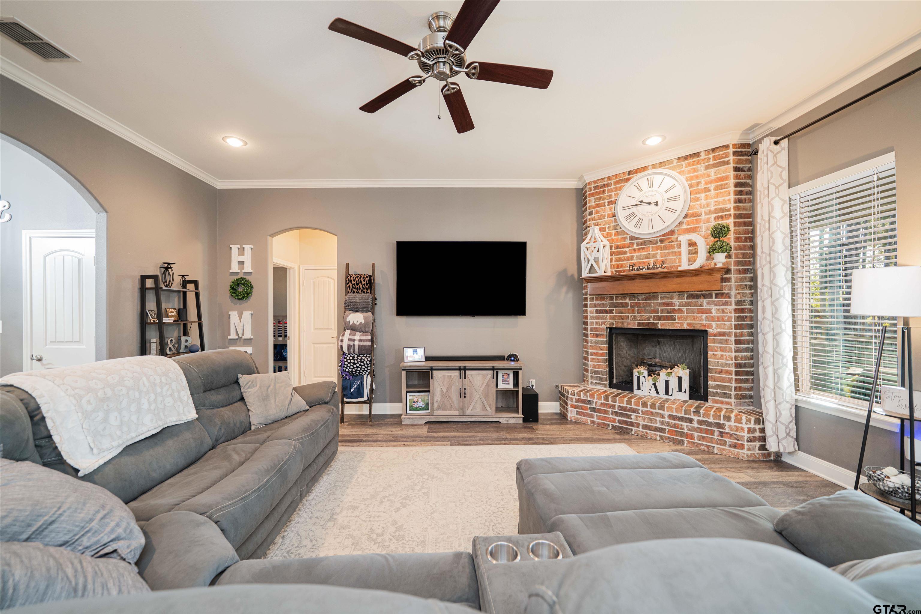 1001 Millstone Lane Chandler, TX 75758 - Photo 5 of 30 a living room with furniture fireplace and a flat screen tv