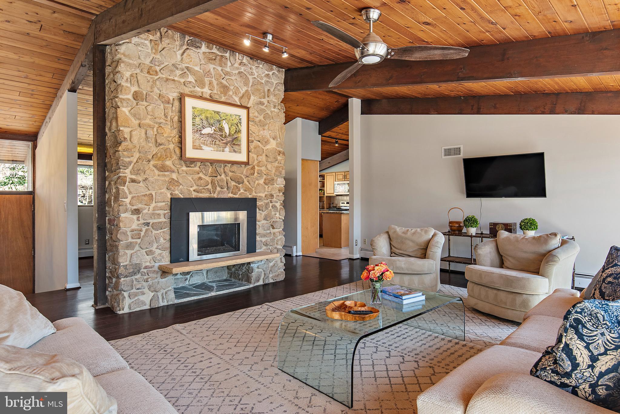 519 Epping Forest Road Annapolis, MD 21401 - Photo 19 of 73 a living room with furniture a flat screen tv and a fireplace