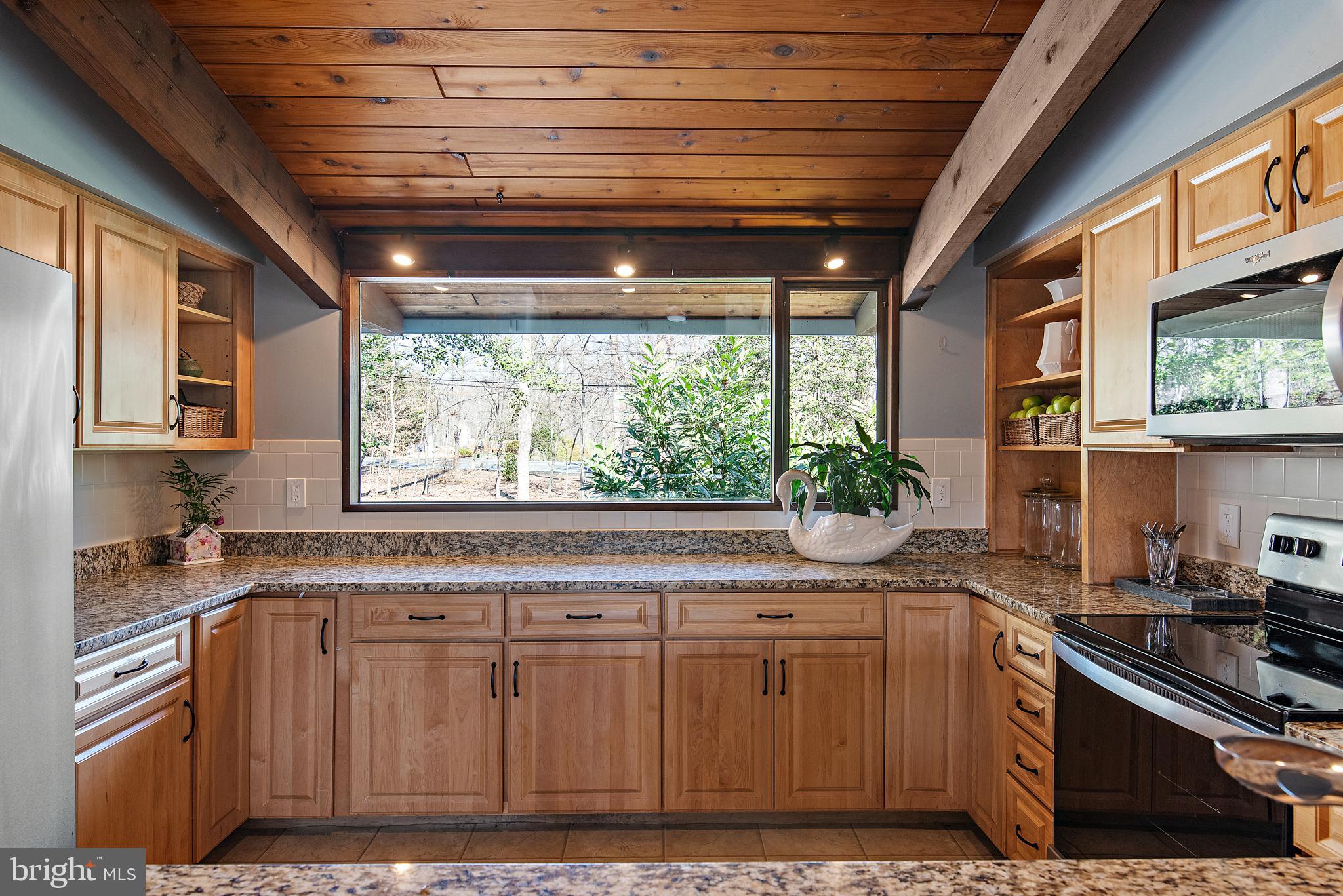 519 Epping Forest Road Annapolis, MD 21401 - Photo 33 of 73 a kitchen with stainless steel appliances granite countertop a sink a stove and cabinets