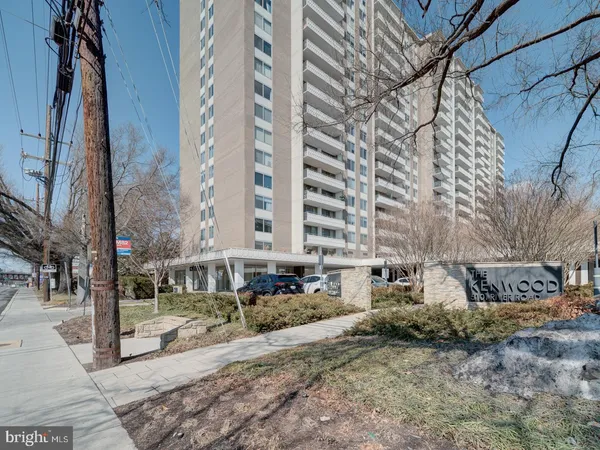 a view of a building with a yard