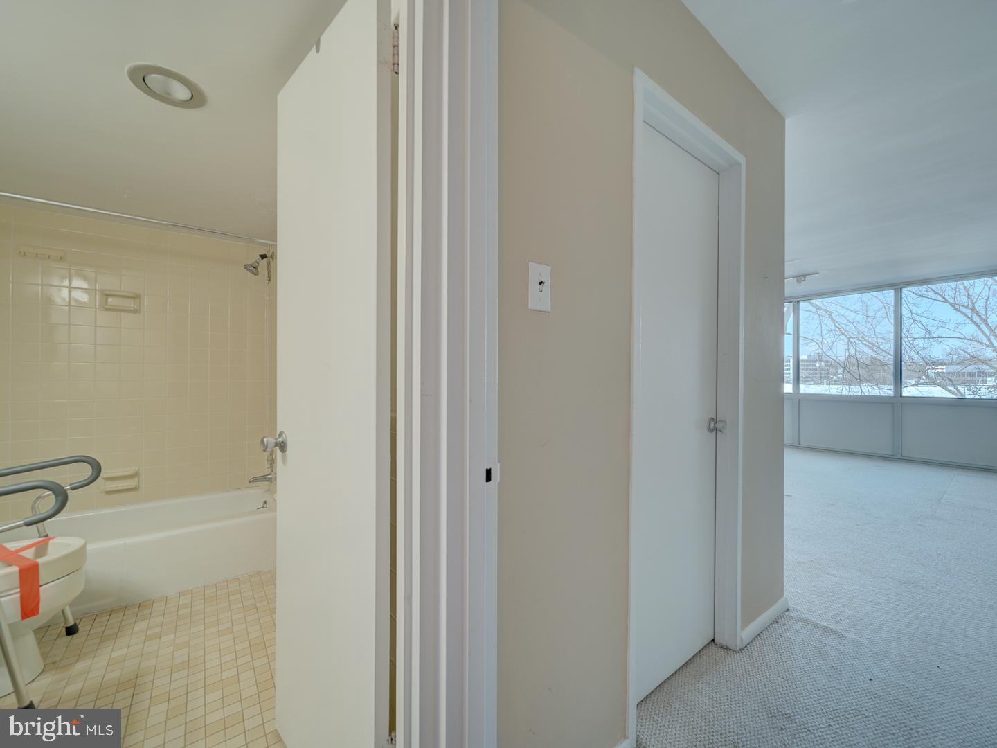 5101 River Road, Unit 411 Bethesda, MD 20816 - Photo 19 of 26 a bathroom with a bathtub and shower