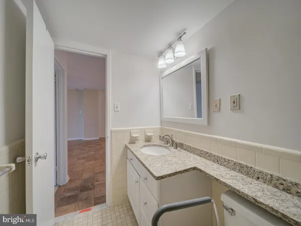 an empty room with large windows