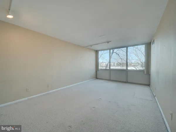 a view of an empty room with a window