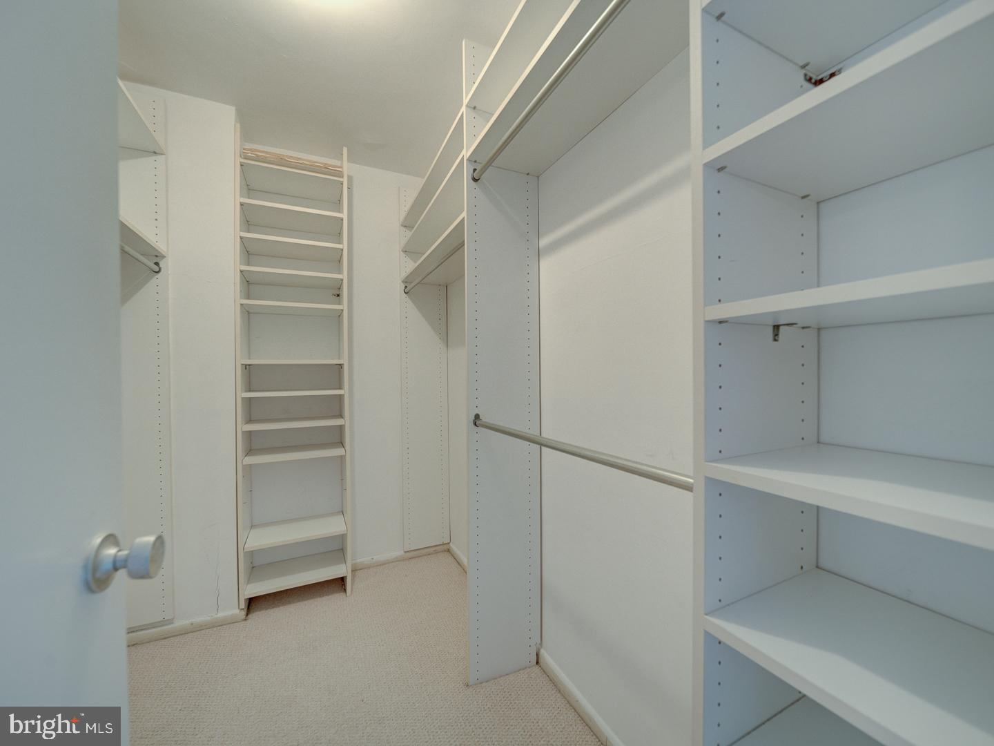 5101 River Road, Unit 411 Bethesda, MD 20816 - Photo 26 of 26 a view of walk in closet with empty racks