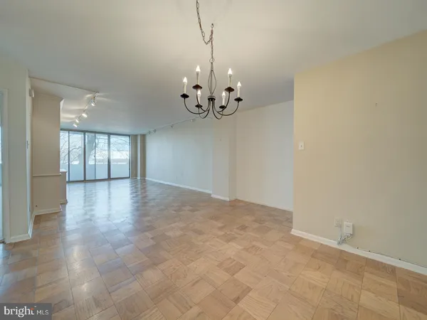a view of an empty room with a window