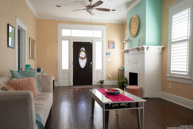 a living room with furniture and a fireplace