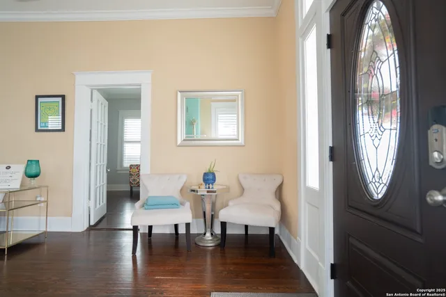a view of a livingroom with furniture window and wooden floor