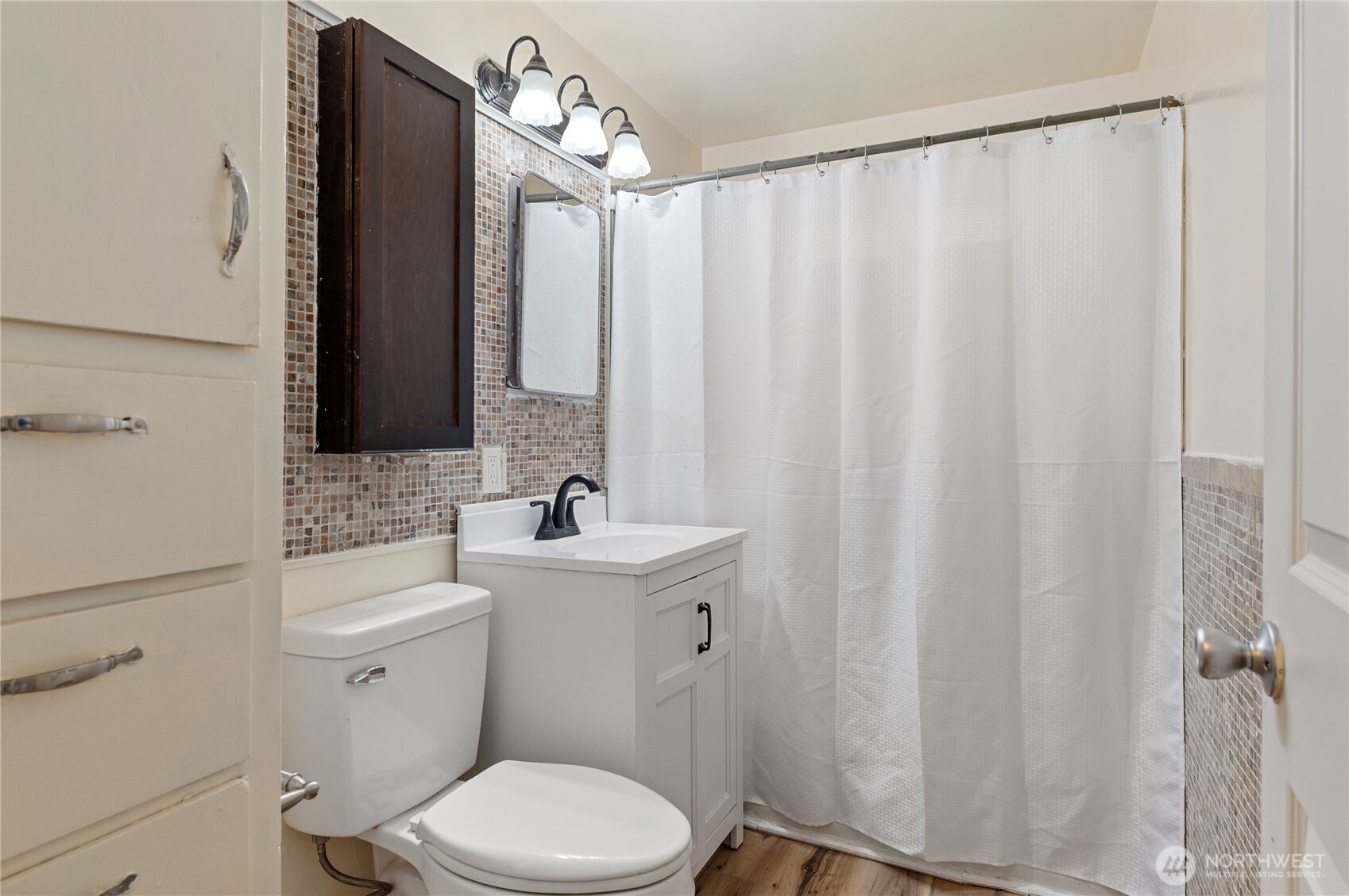 944 East 30th Street Bremerton, WA 98310 - Photo 12 of 21 a bathroom with a toilet a sink and a mirror