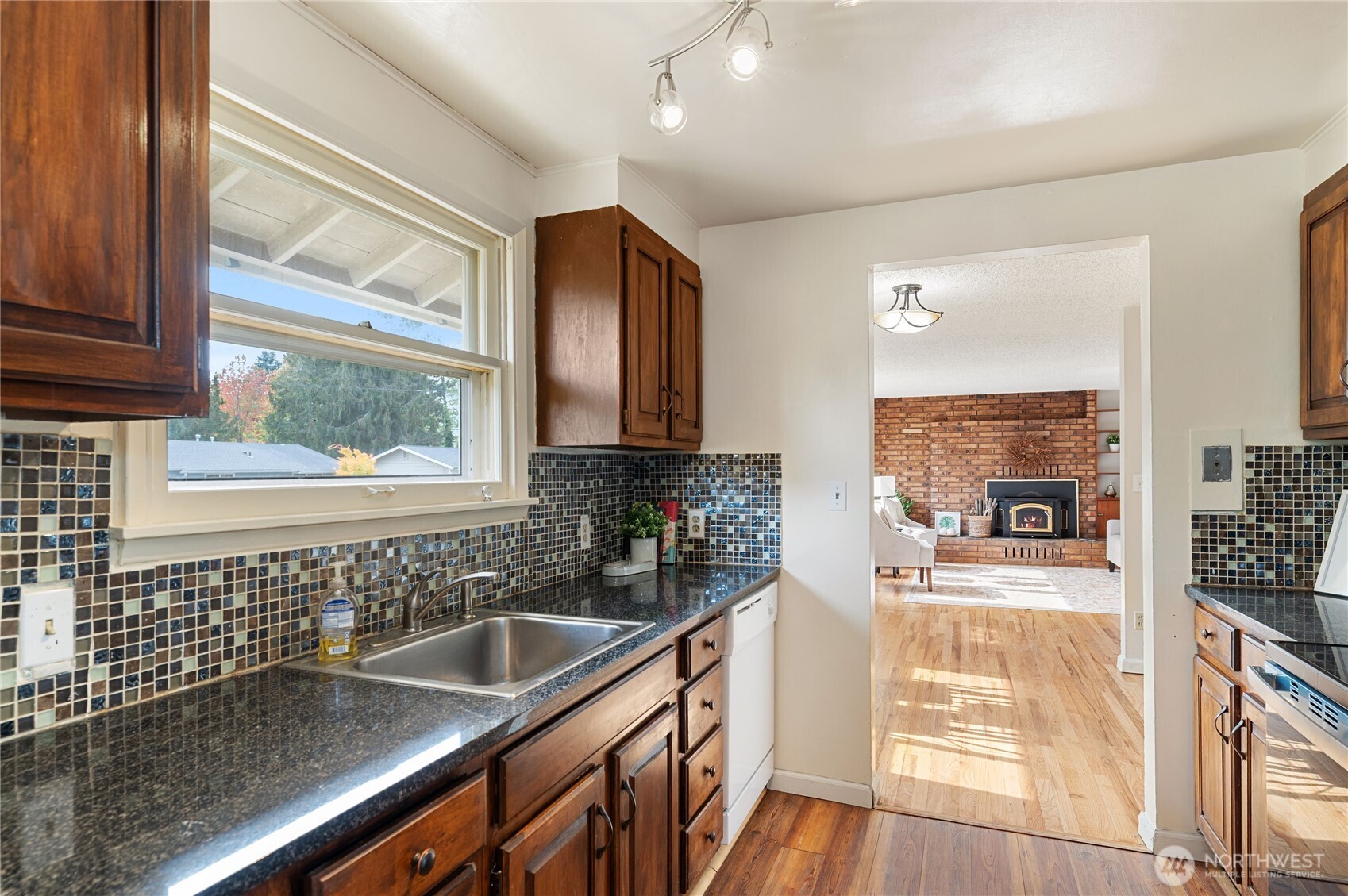 944 East 30th Street Bremerton, WA 98310 - Photo 9 of 21 a kitchen with a sink and a stove top oven
