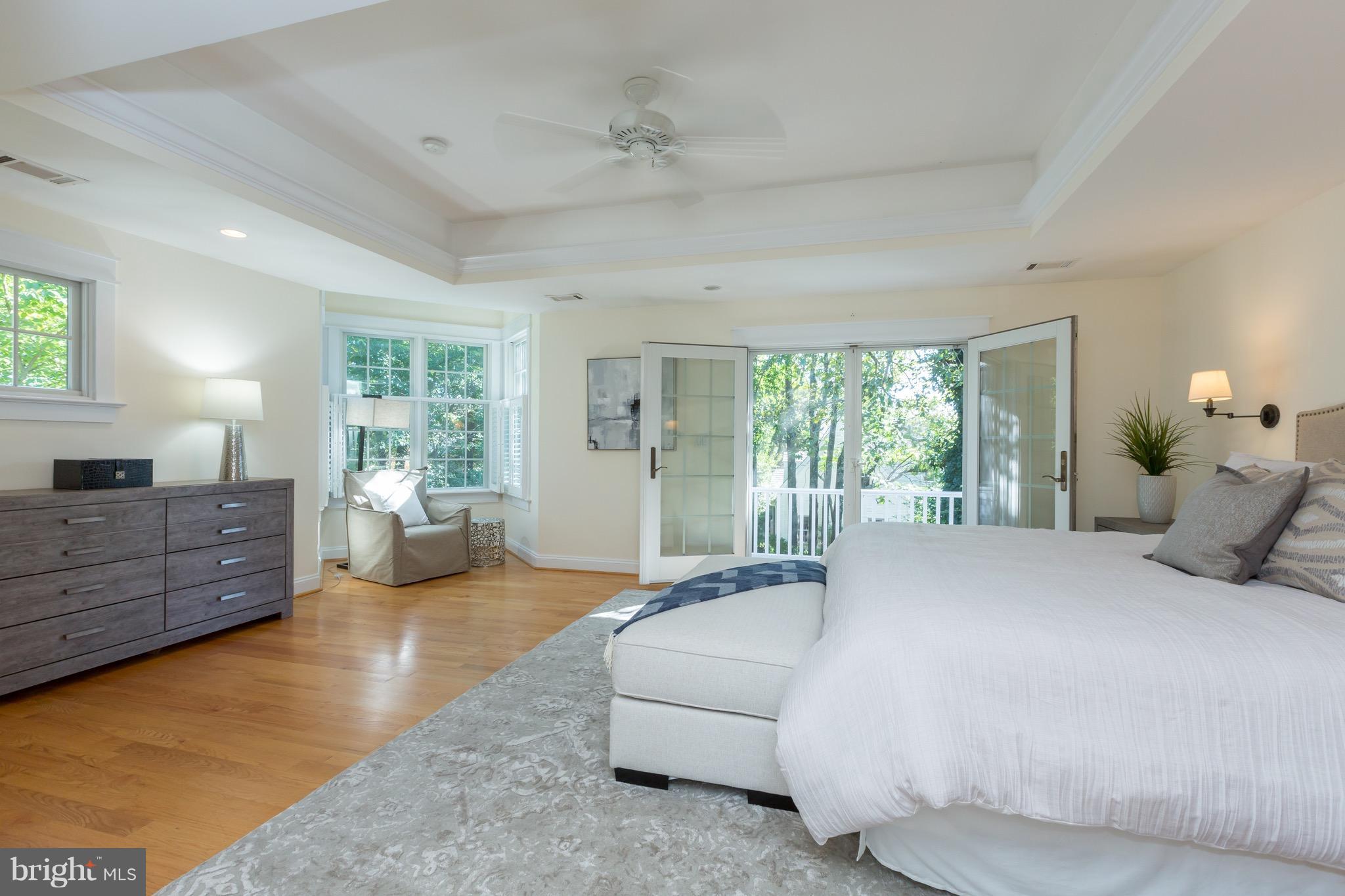 4926 43rd Place Northwest Washington, DC 20016 - Photo 11 of 23 a bedroom with a bed and large windows