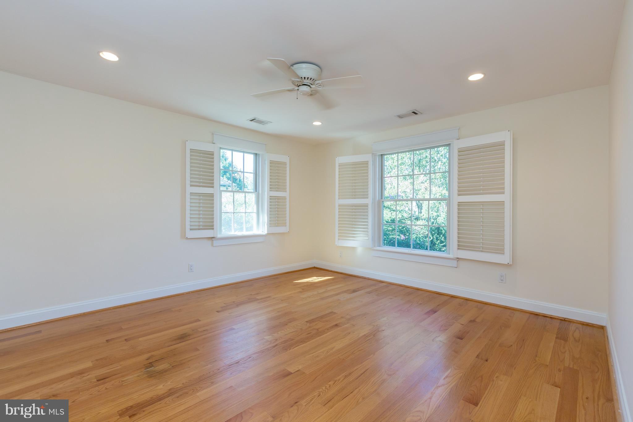 4926 43rd Place Northwest Washington, DC 20016 - Photo 14 of 23 an empty room with wooden floor and windows