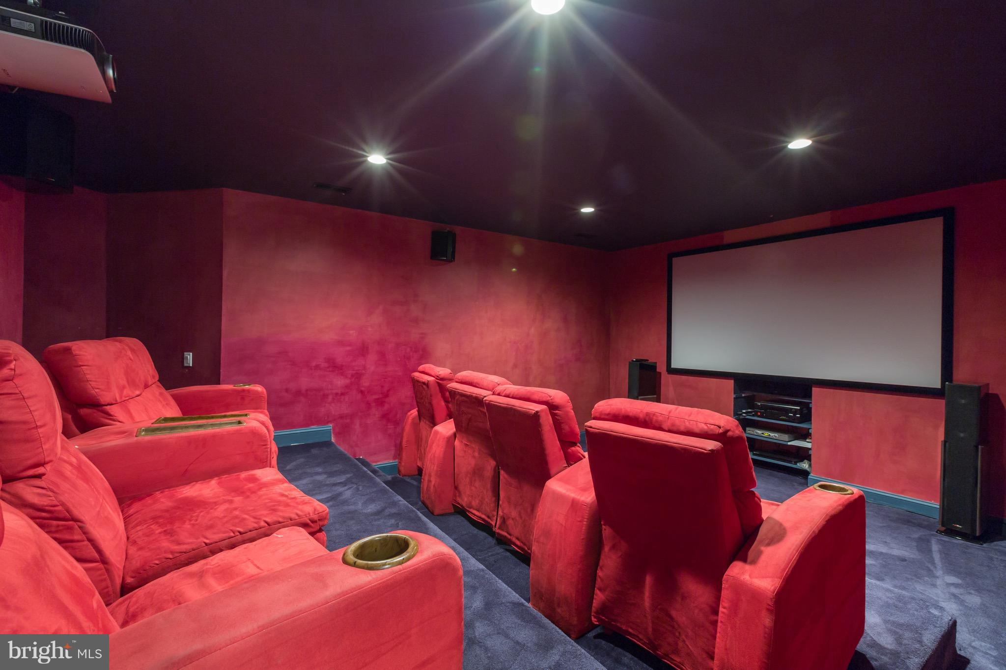 4926 43rd Place Northwest Washington, DC 20016 - Photo 18 of 23 a projector room with furniture and a projector screen