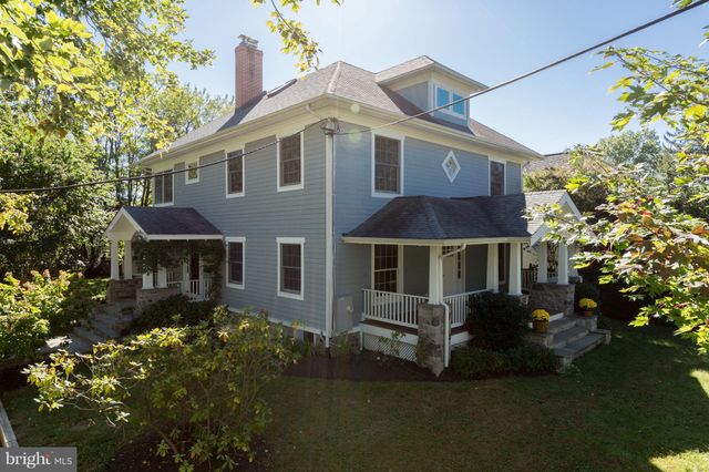 front view of a house with a garden