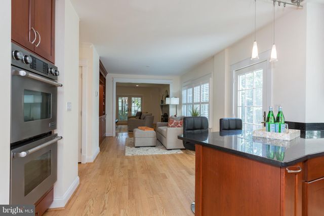 a living room with fireplace furniture and a flat screen tv