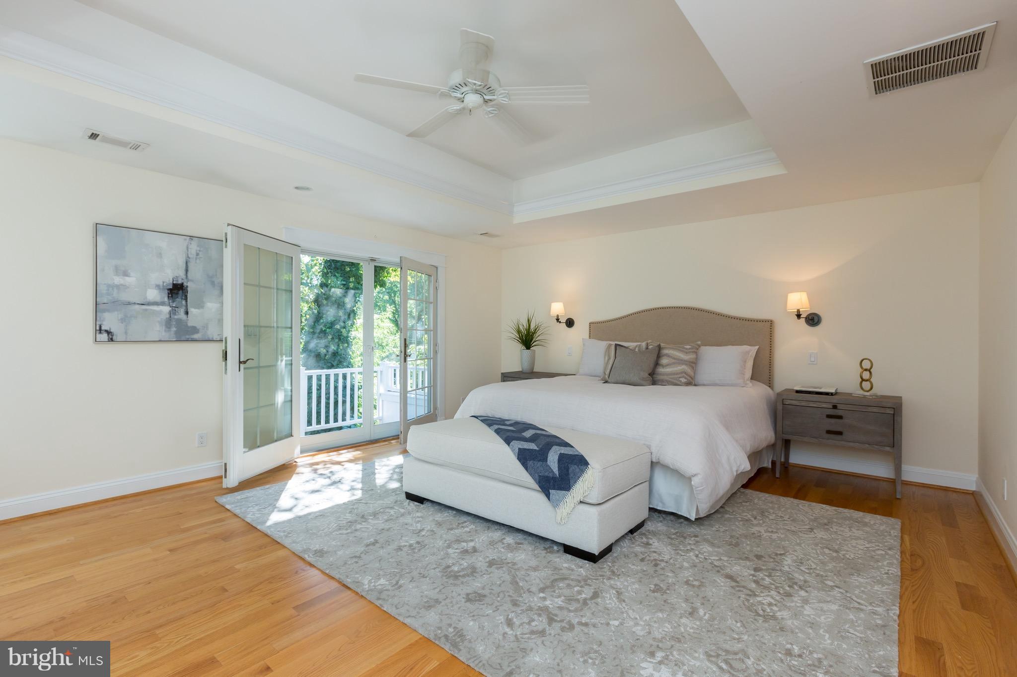 4926 43rd Place Northwest Washington, DC 20016 - Photo 10 of 23 a bedroom with a bed and glass window