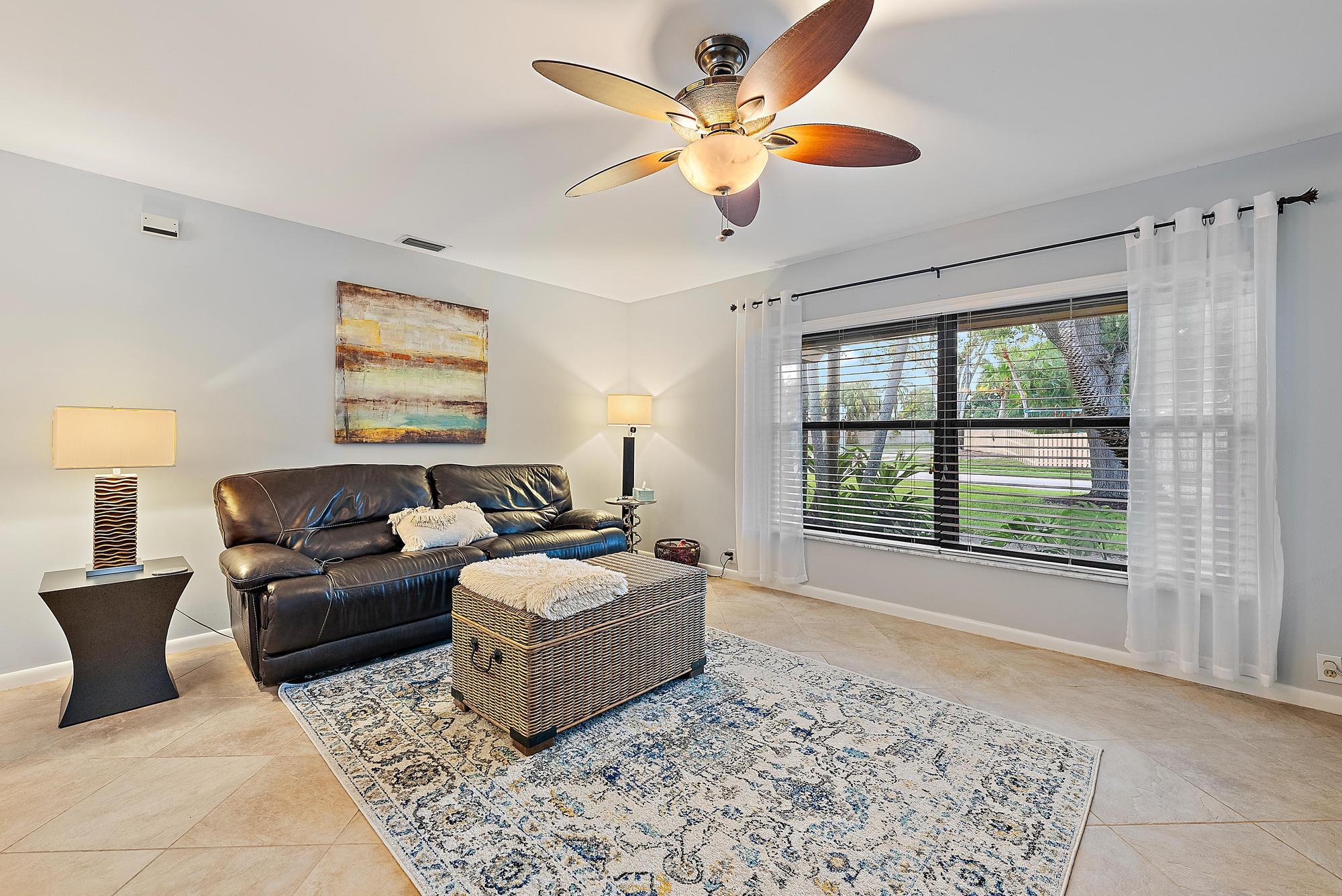 126 Coco Lane Jupiter, FL 33458 - Photo 12 of 40 a living room with furniture and a large window