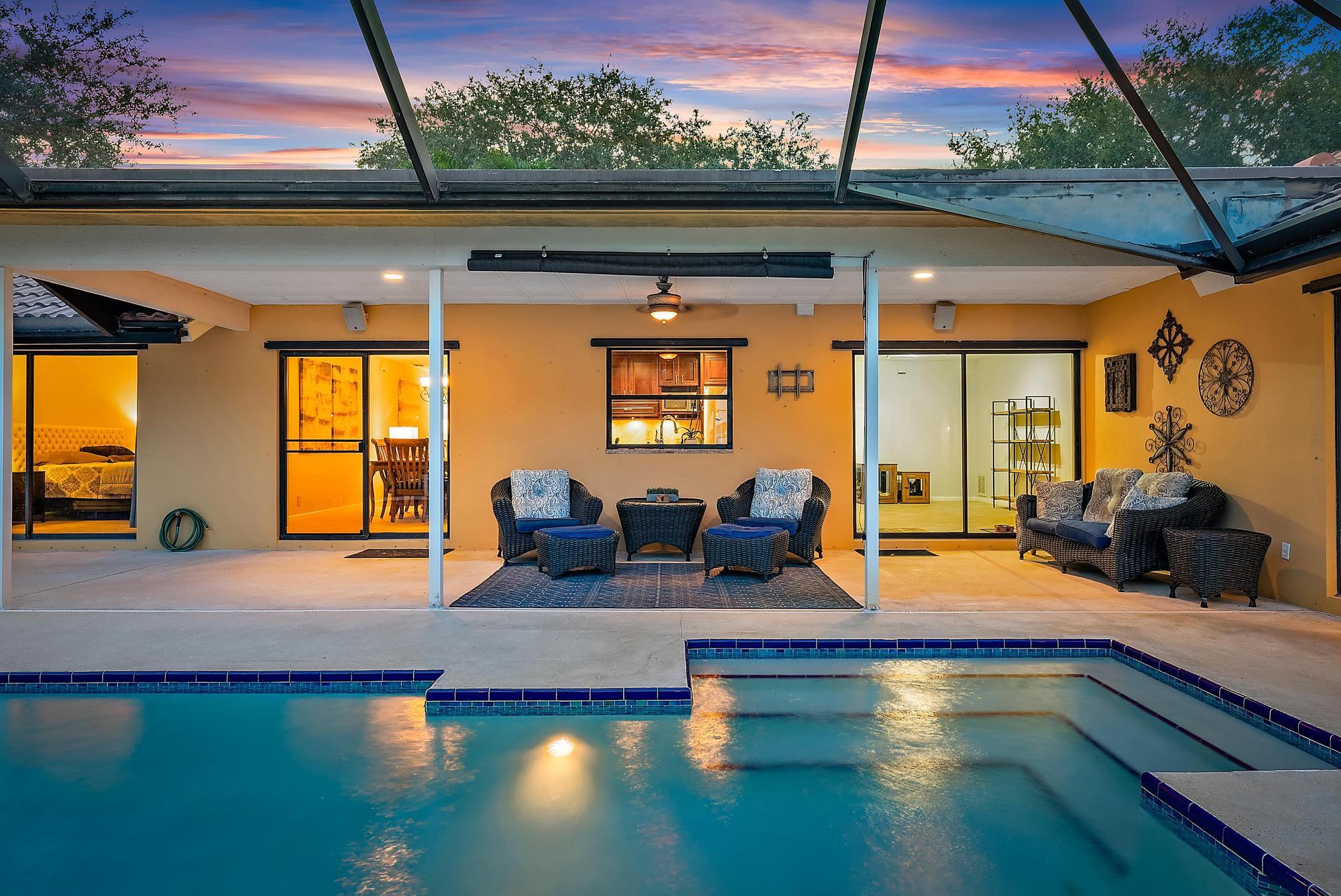 126 Coco Lane Jupiter, FL 33458 - Photo 25 of 40 a living room with furniture and a large window
