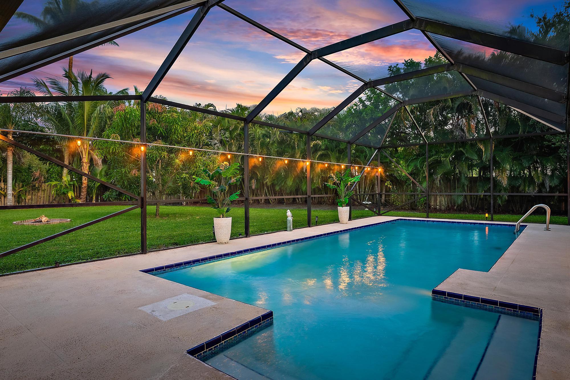 126 Coco Lane Jupiter, FL 33458 - Photo 3 of 40 a view of a backyard with a swimming pool