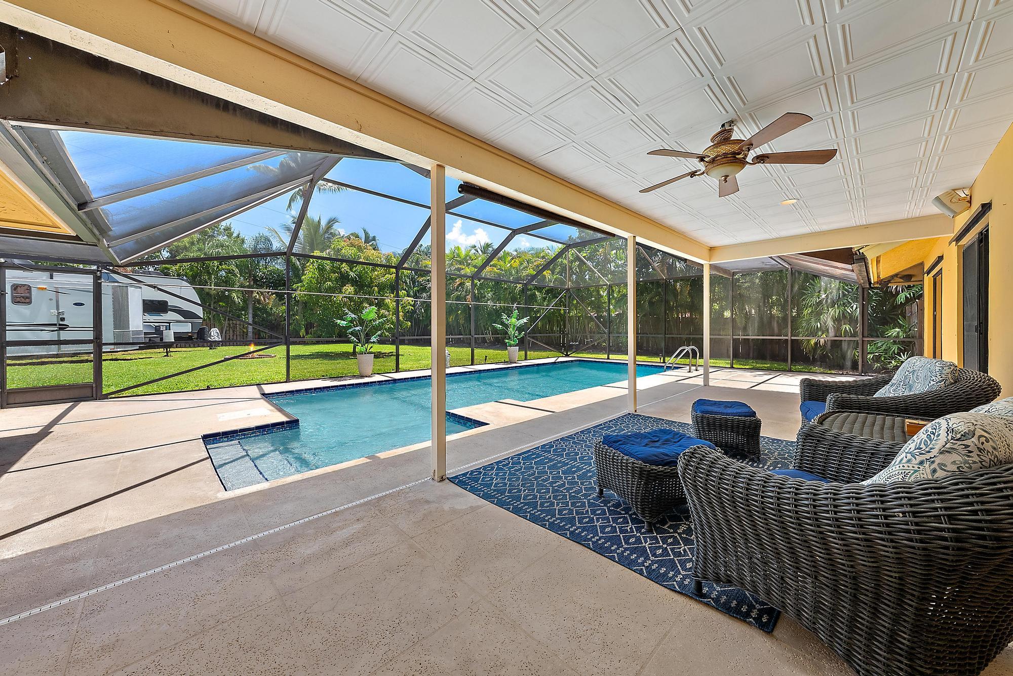 126 Coco Lane Jupiter, FL 33458 - Photo 33 of 40 a view of swimming pool with a patio