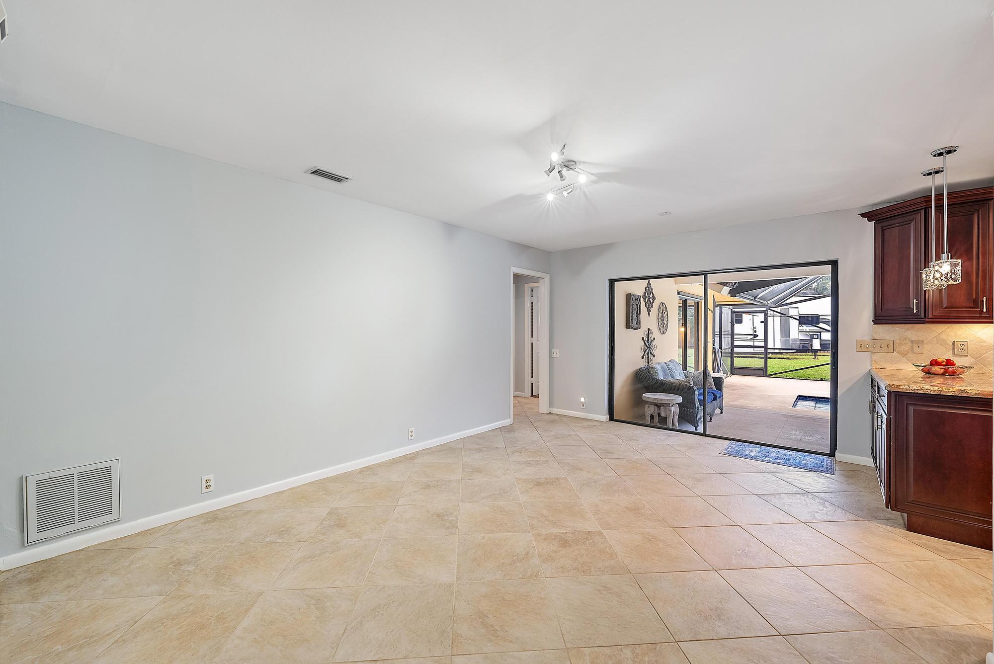126 Coco Lane Jupiter, FL 33458 - Photo 8 of 40 a view of an empty room with a window