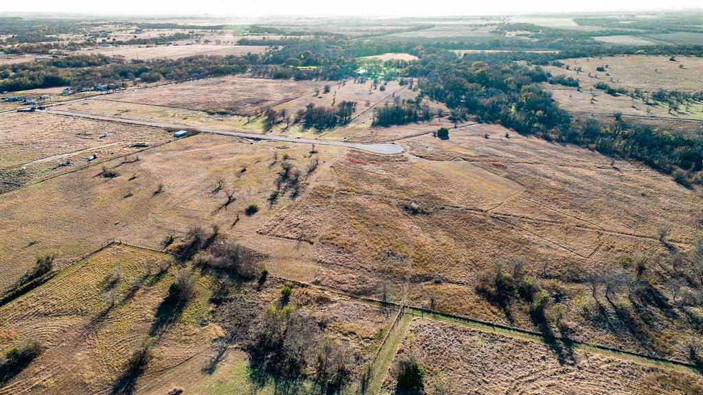 Tbd Tbd Ranchside Itasca, TX 76055 - Photo 9 of 12 a view of a dry yard with wooden floor