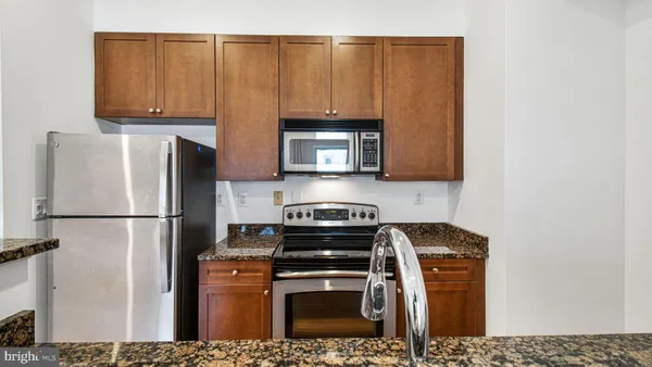 a view of a kitchen with electric appliances