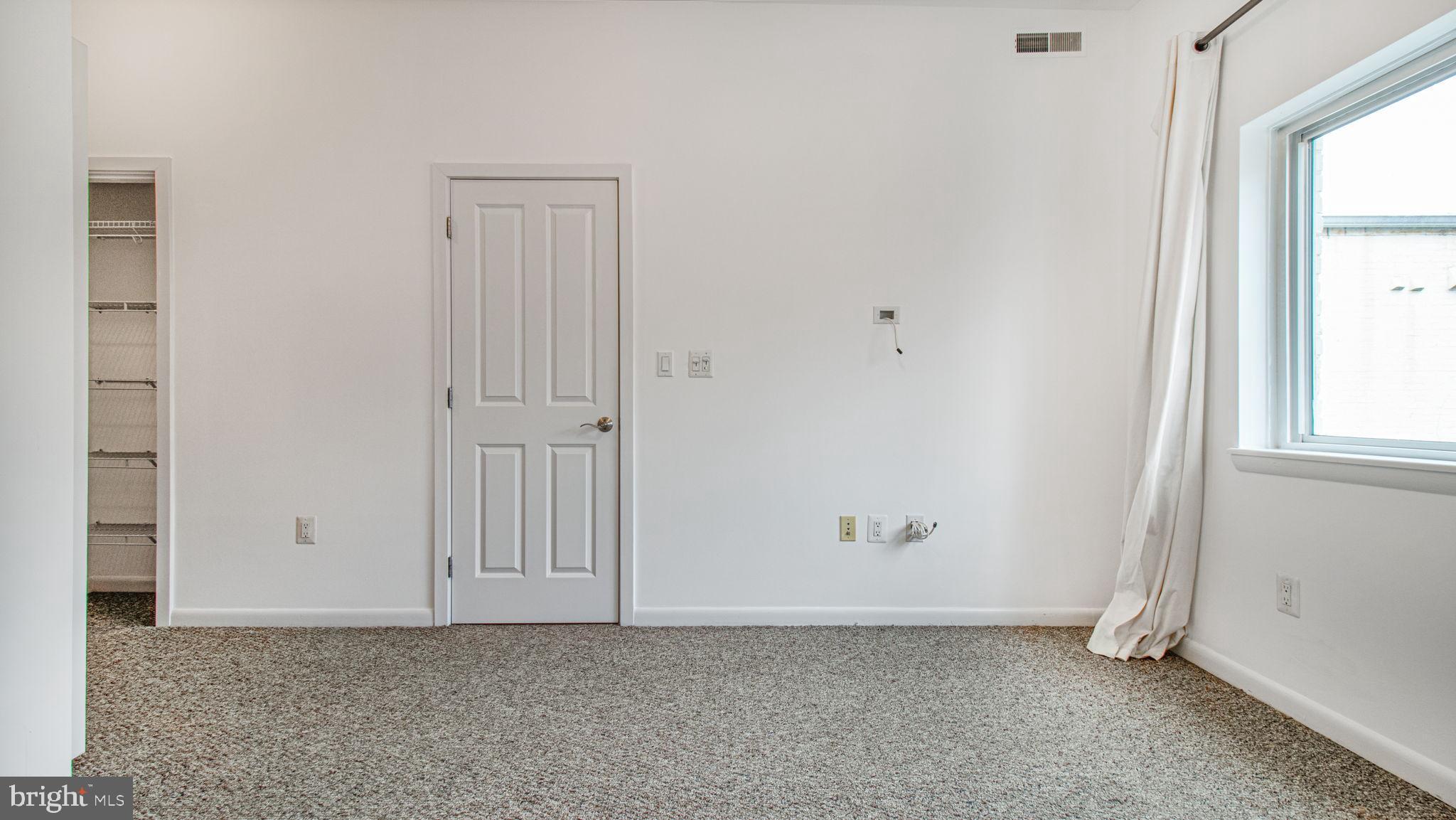 1501 27th Street Southeast, Unit 406 Washington, DC 20020 - Photo 20 of 44 an empty room with windows