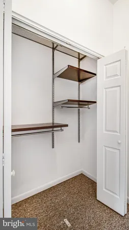 a bathroom with a bathtub and mirror
