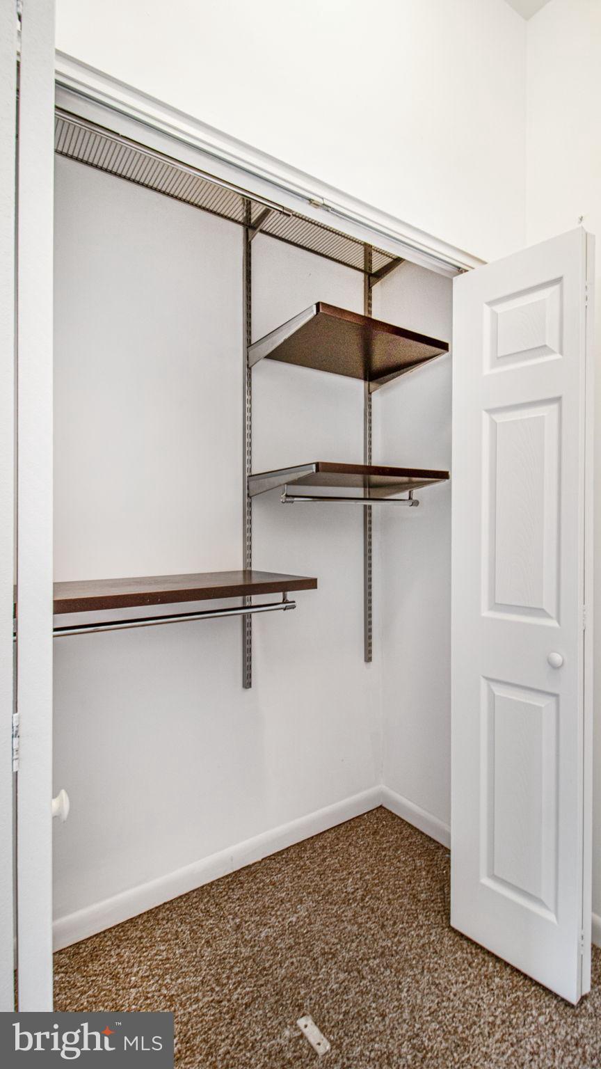 1501 27th Street Southeast, Unit 406 Washington, DC 20020 - Photo 25 of 44 a view of a room with racks on the wall