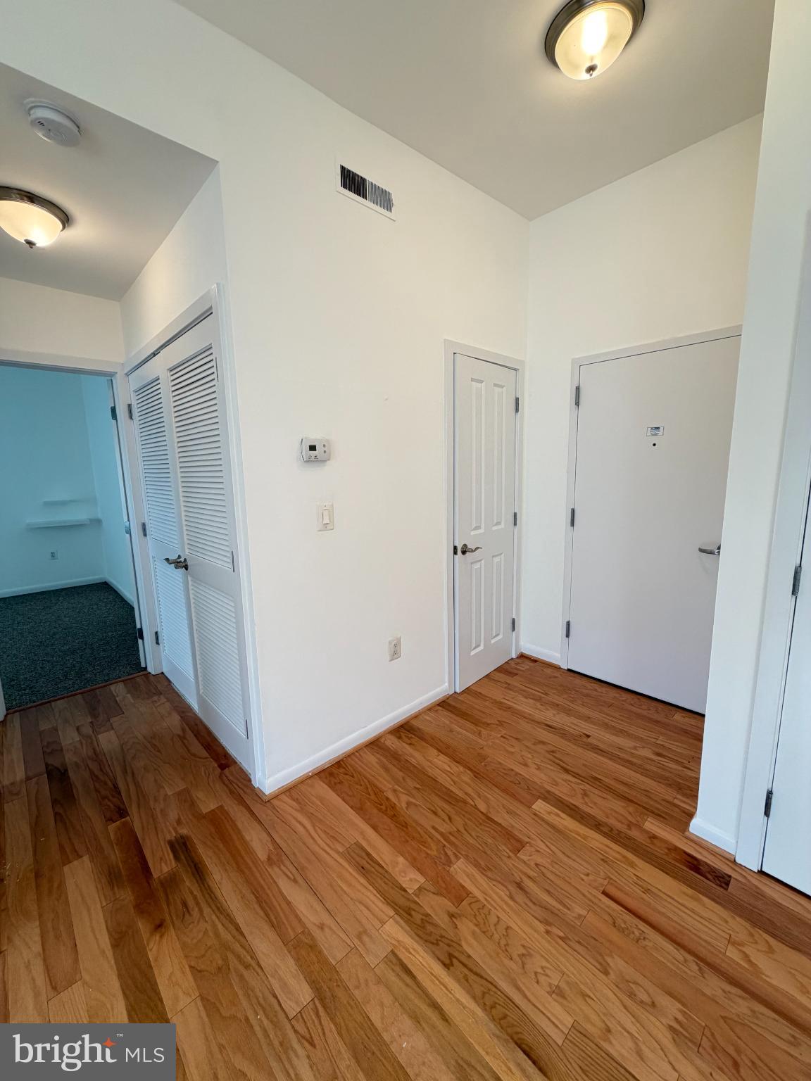 1501 27th Street Southeast, Unit 406 Washington, DC 20020 - Photo 9 of 44 a view of a room with wooden floor