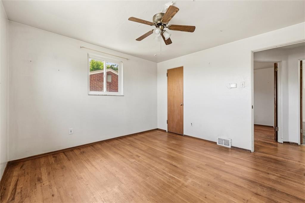 328 Ruthwood Avenue Pittsburgh, PA 15227 - Photo 16 of 32 an empty room with wooden floor and windows