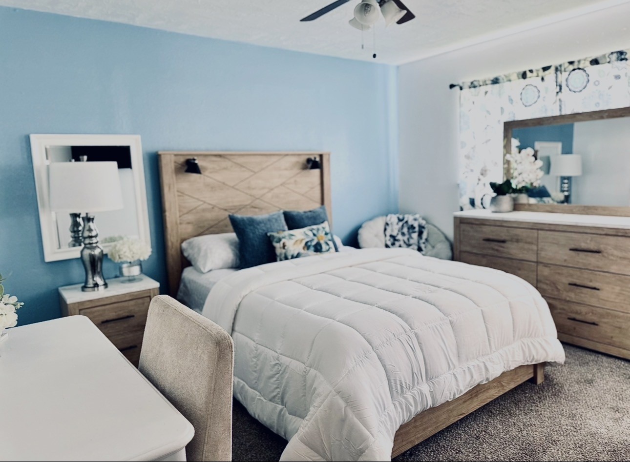 1457 Camellia Street Sweeny, TX 77480 - Photo 22 of 26 a bedroom with bed and a chandelier