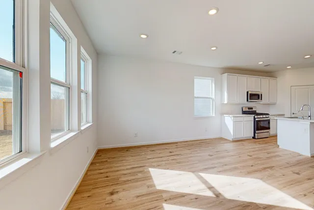 a view of a kitchen with microwave and cabinets