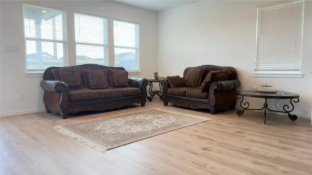 a living room with furniture and a window
